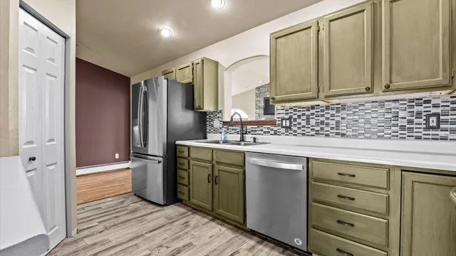 a kitchen with a sink stove and microwave