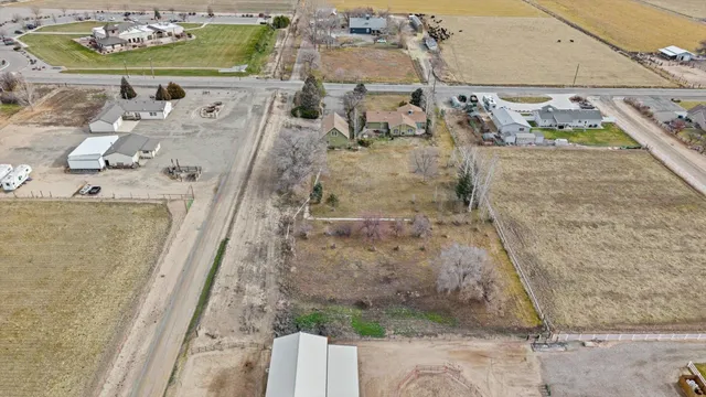 an aerial view of a residential houses with outdoor space