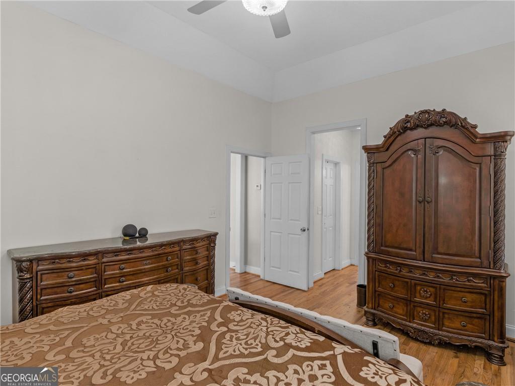 355 Parker Road Covington, GA 30014 - Photo 49 of 60 a living room with a dresser and a wooden floor