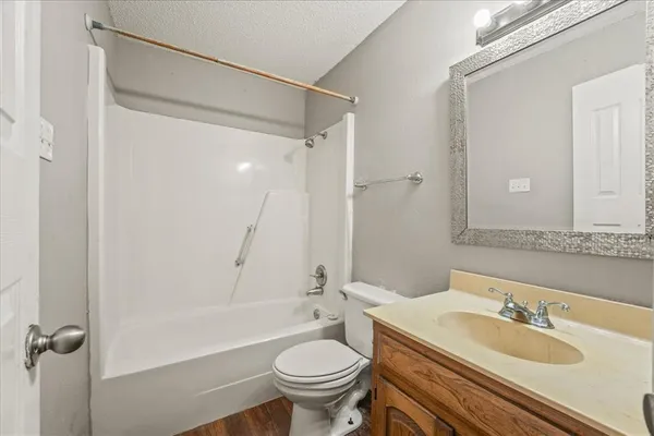 a bathroom with a sink toilet tub and shower