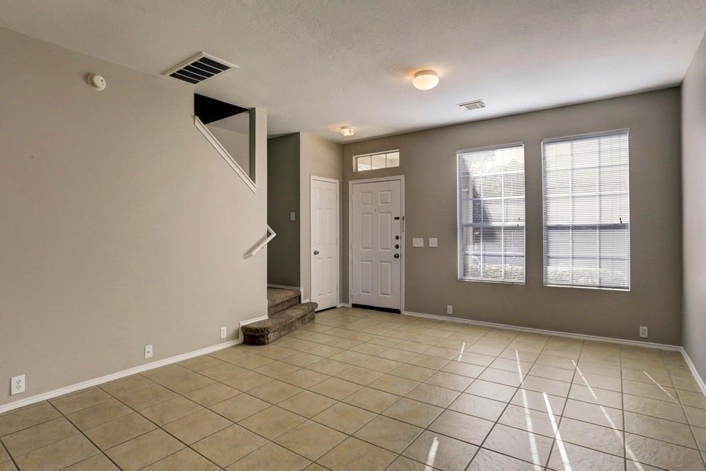 23830 Single Oak Street Spring, TX 77373 - Photo 2 of 10 a view of an empty room with window and a bathroom