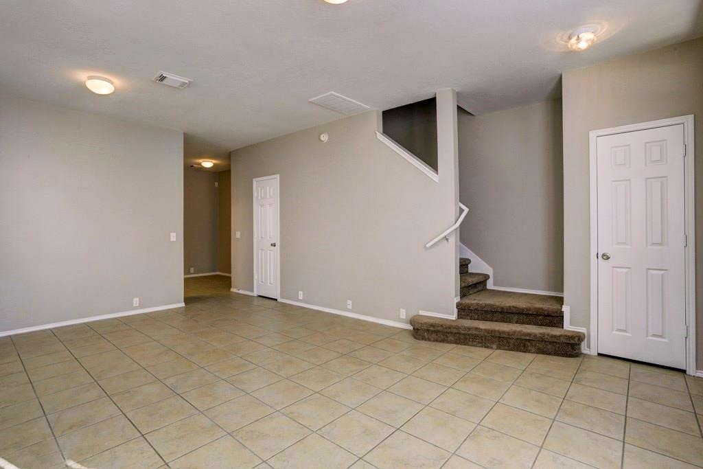 23830 Single Oak Street Spring, TX 77373 - Photo 5 of 10 an empty room with staircase