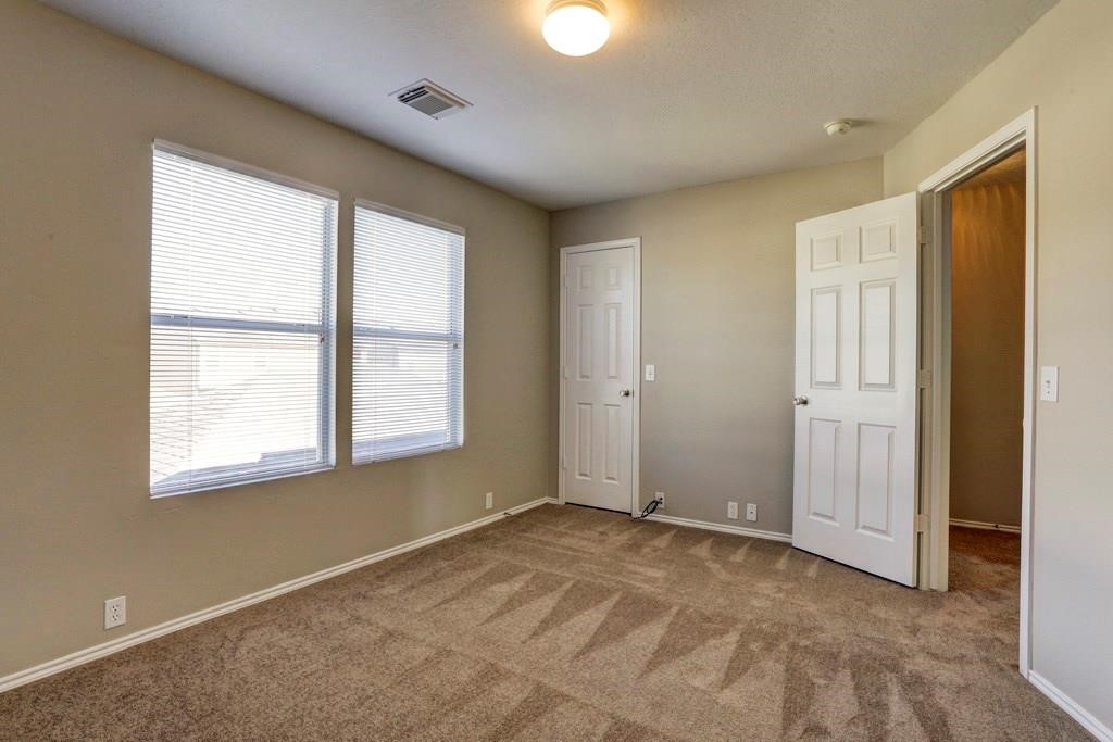 23830 Single Oak Street Spring, TX 77373 - Photo 7 of 10 a view of an empty room with a window