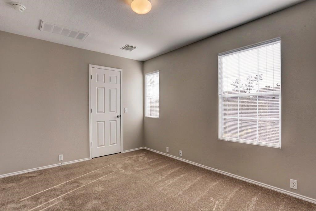 23830 Single Oak Street Spring, TX 77373 - Photo 8 of 10 an empty room with windows