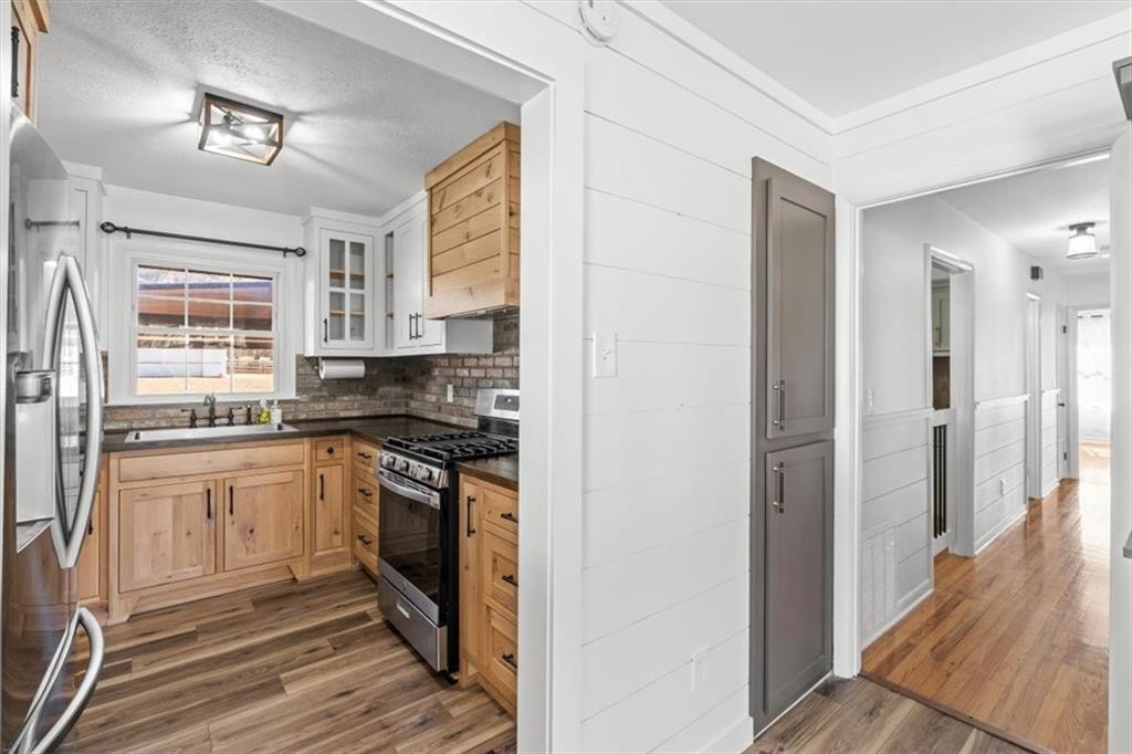 240 John Phillips Road Cedartown, GA 30125 - Photo 12 of 55 a kitchen with stainless steel appliances granite countertop a refrigerator and a sink