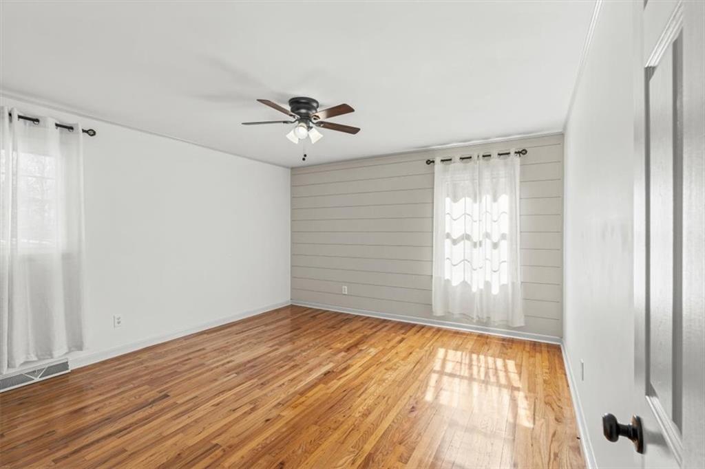 240 John Phillips Road Cedartown, GA 30125 - Photo 17 of 55 a view of empty room with wooden floor and fan