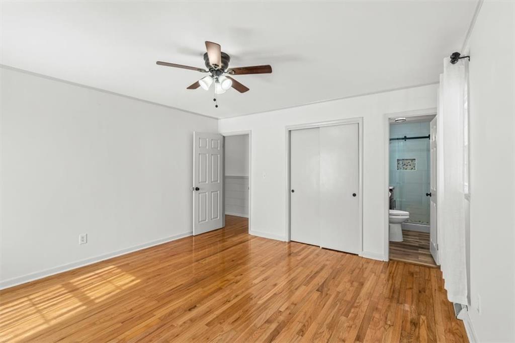 240 John Phillips Road Cedartown, GA 30125 - Photo 18 of 55 a view of empty room with wooden floor and fan