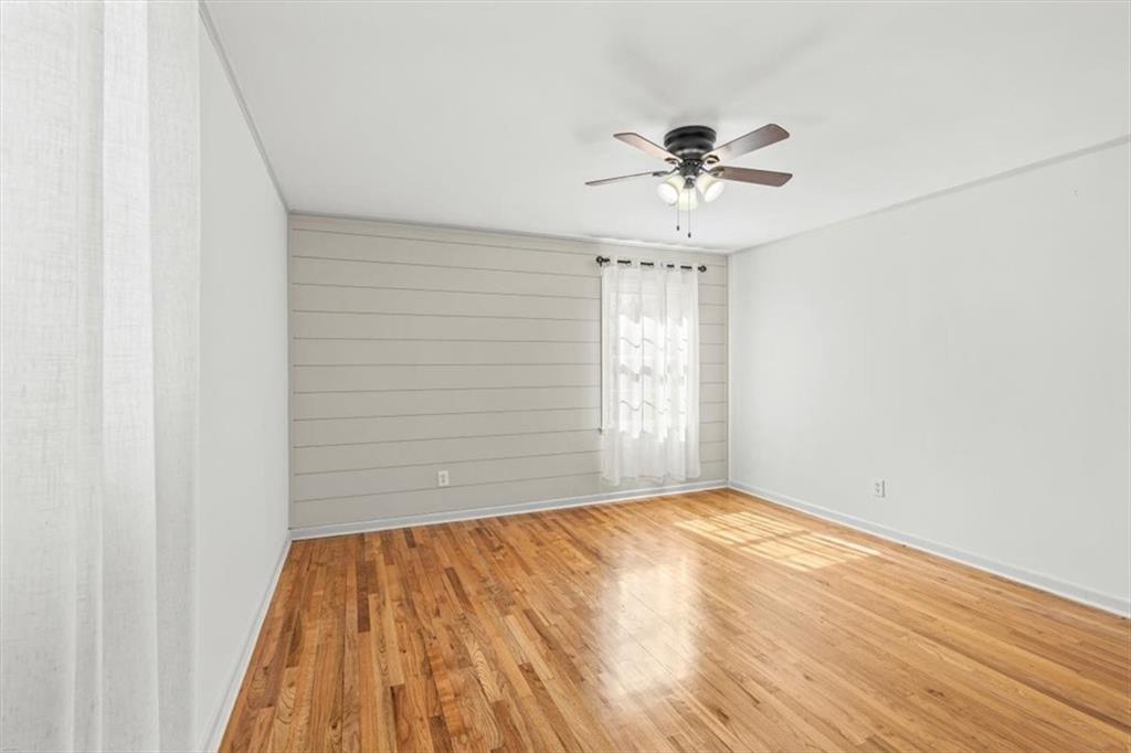 240 John Phillips Road Cedartown, GA 30125 - Photo 19 of 55 a view of empty room with wooden floor and fan