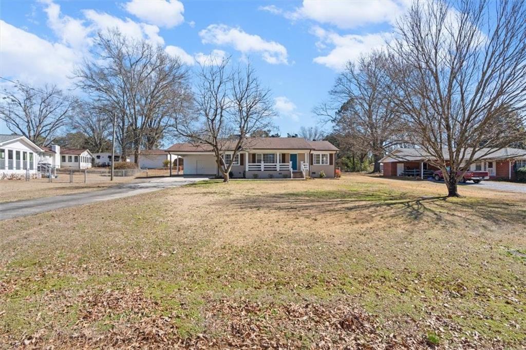 240 John Phillips Road Cedartown, GA 30125 - Photo 2 of 55 a view of a yard with a house