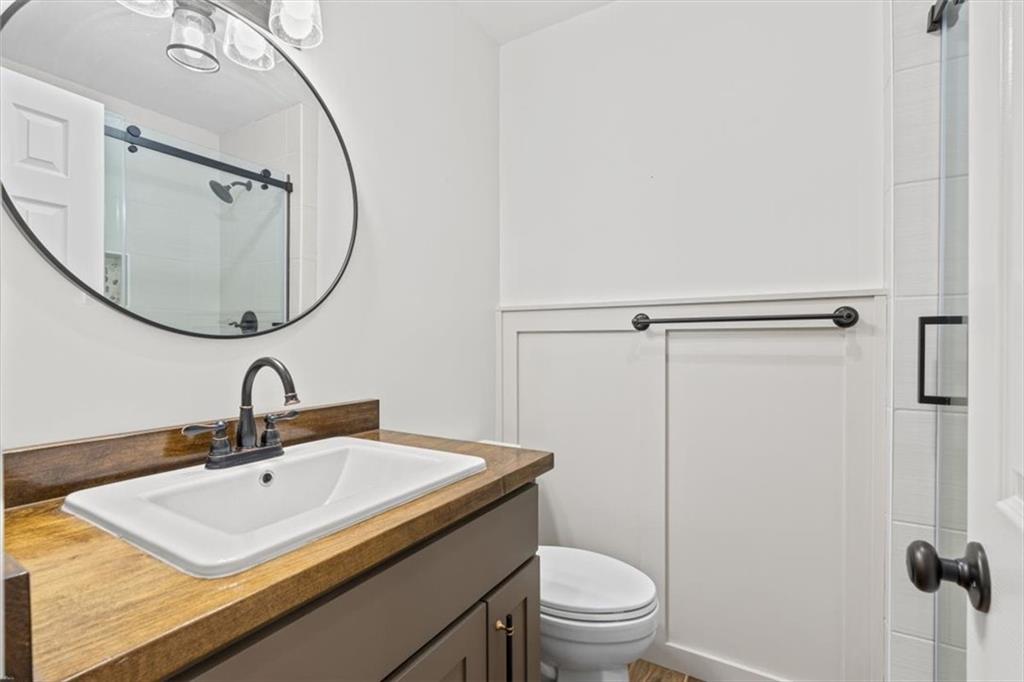 240 John Phillips Road Cedartown, GA 30125 - Photo 23 of 55 a bathroom with a sink a toilet and a mirror