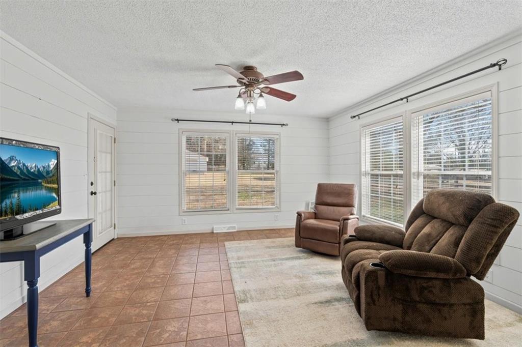 240 John Phillips Road Cedartown, GA 30125 - Photo 28 of 55 a living room with furniture and a flat screen tv