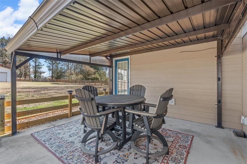 240 John Phillips Road Cedartown, GA 30125 - Photo 32 of 55 a view of a porch with furniture and wooden floor