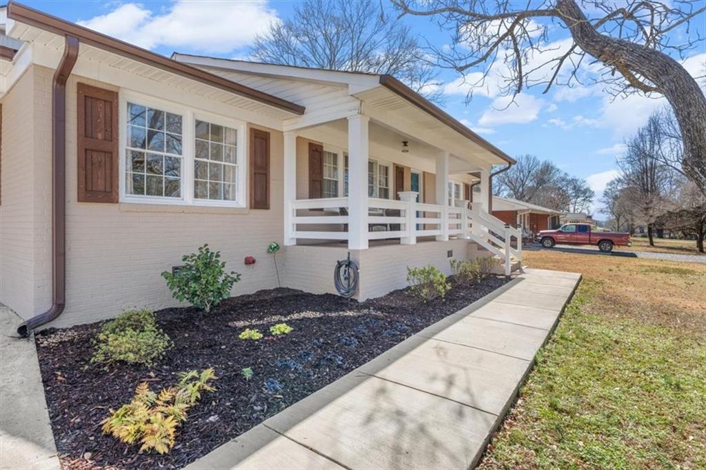240 John Phillips Road Cedartown, GA 30125 - Photo 4 of 55 a front view of a house with garden
