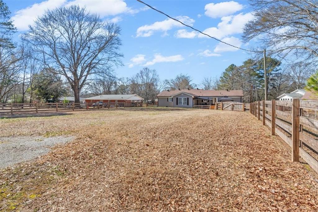 240 John Phillips Road Cedartown, GA 30125 - Photo 45 of 55 a view of house with yard and sitting area