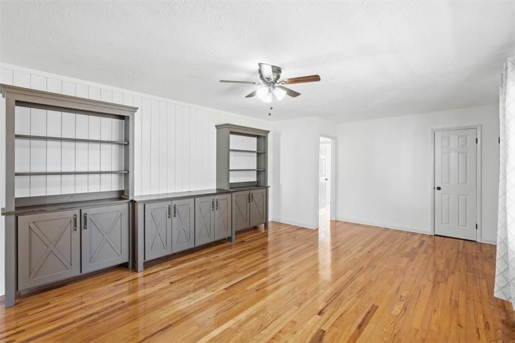 240 John Phillips Road Cedartown, GA 30125 - Photo 8 of 55 a view of empty room with wooden floor and fan