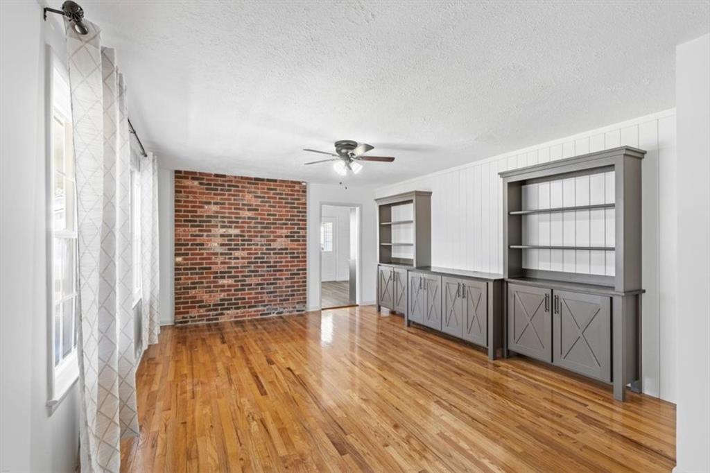 240 John Phillips Road Cedartown, GA 30125 - Photo 9 of 55 a view of an empty room with a window and wooden floor