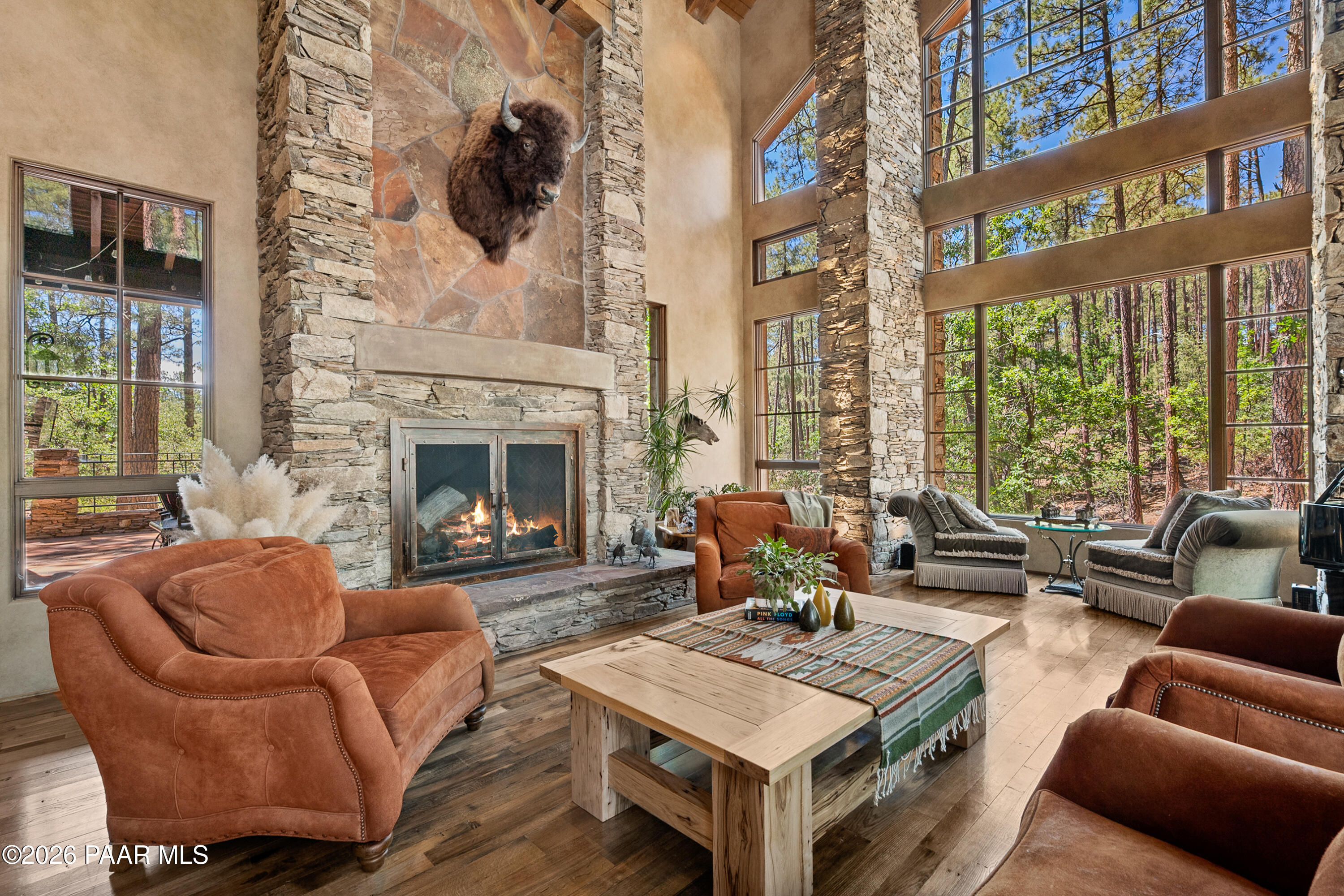 1515 High Valley Ranch Road Prescott, AZ 86303 - Photo 14 of 76 a living room with furniture a fireplace and windows