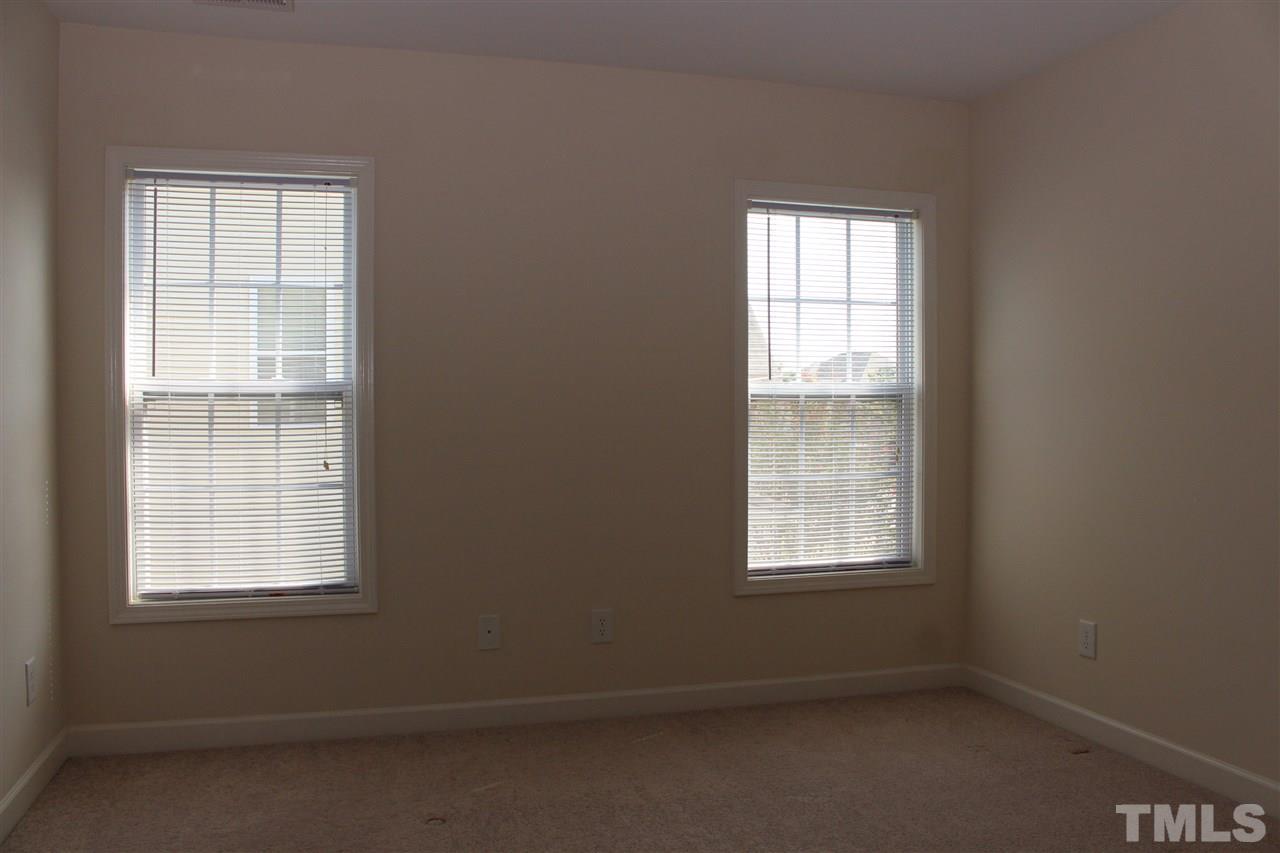 5125 Holly Ridge Farm Road Raleigh, NC 27616 - Photo 14 of 22 an empty room with a window