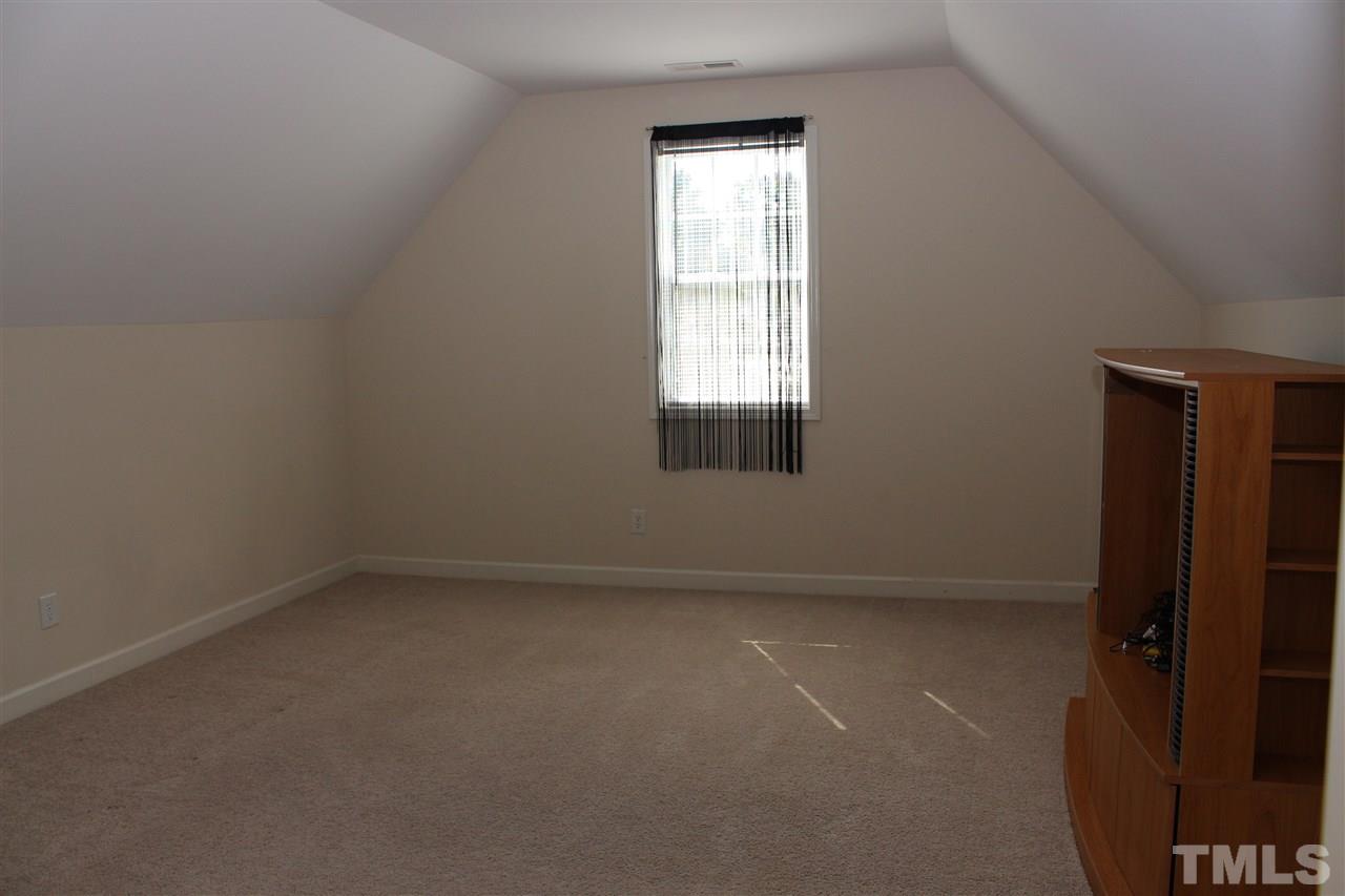 5125 Holly Ridge Farm Road Raleigh, NC 27616 - Photo 15 of 22 an empty room with a window