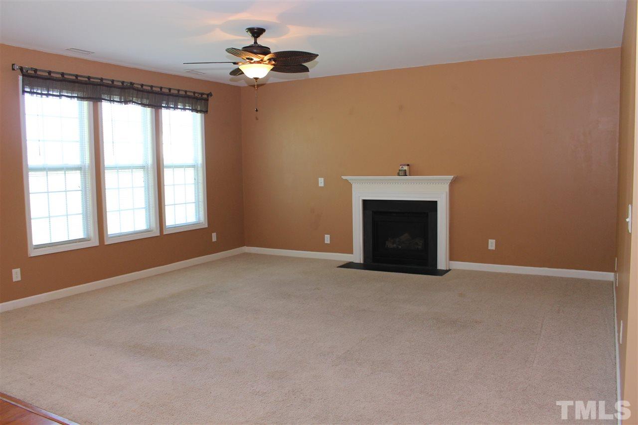 5125 Holly Ridge Farm Road Raleigh, NC 27616 - Photo 6 of 22 a view of an empty room with a window