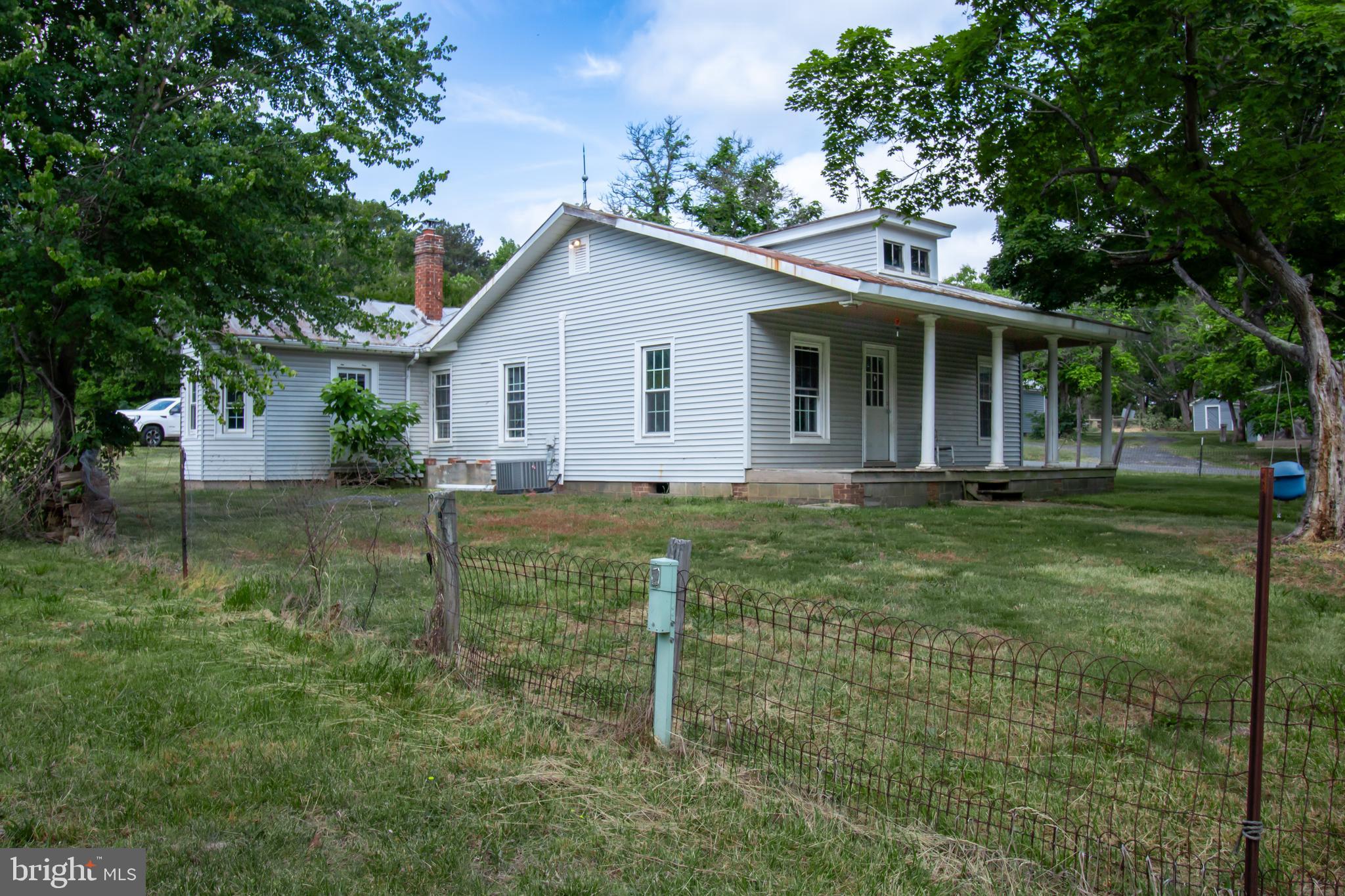 198 Mt Hope Church Road Bumpass, VA 23024 - Photo 2 of 25 a view of a house with backyard and a tree