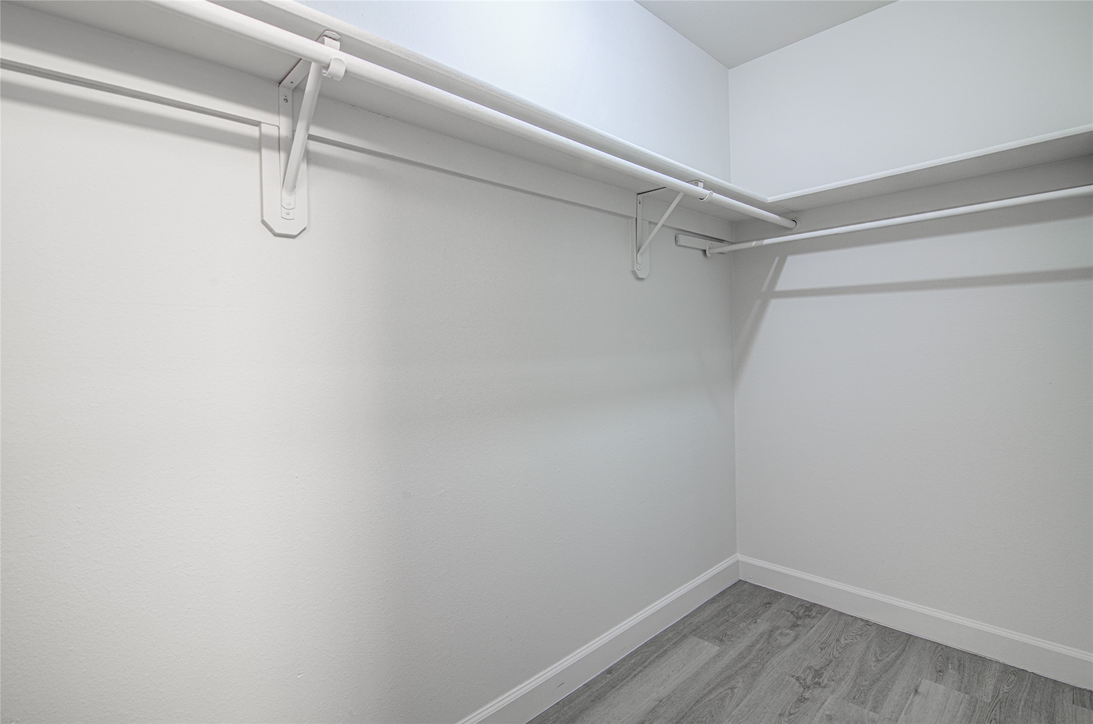 311 West Mary Street Austin, TX 78704 - Photo 10 of 35 A well-organized walk-in closet featuring sturdy shelving and clothing rods for ample storage.