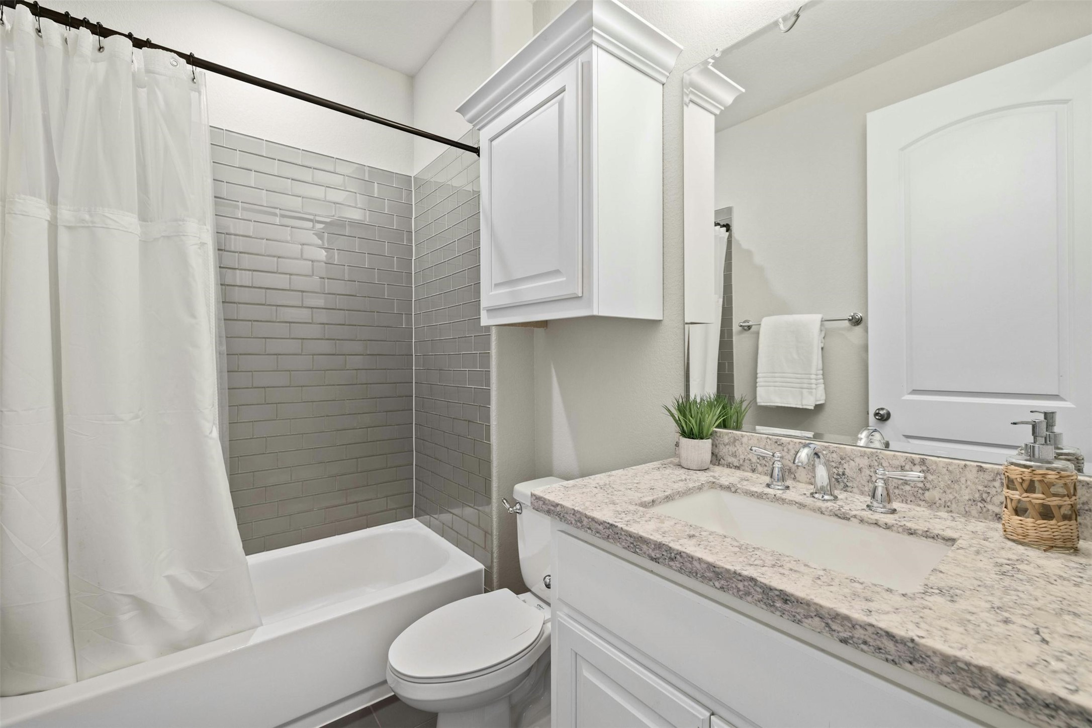 1820 Ficuzza Way Leander, TX 78641 - Photo 17 of 35 The guest bathroom features
modern fixtures and stylish
finishes, providing convenience
and comfort for visitors.