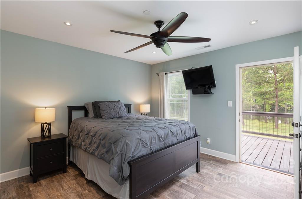 1279 Lake Road Clover, SC 29710 - Photo 18 of 44 a bedroom with a large bed and a tv