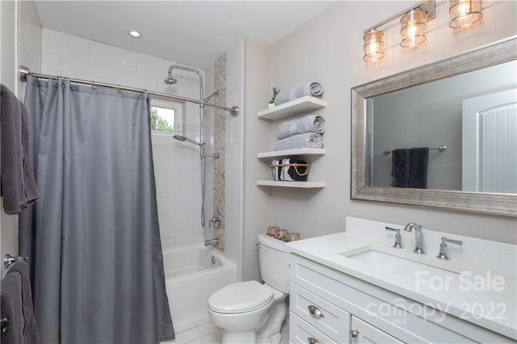 1279 Lake Road Clover, SC 29710 - Photo 19 of 44 a bathroom with a granite countertop sink mirror vanity and toilet
