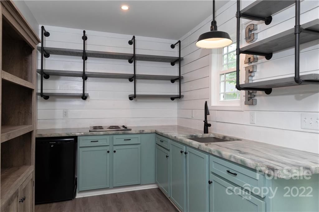 1279 Lake Road Clover, SC 29710 - Photo 22 of 44 a kitchen with stainless steel appliances granite countertop a sink and a stove