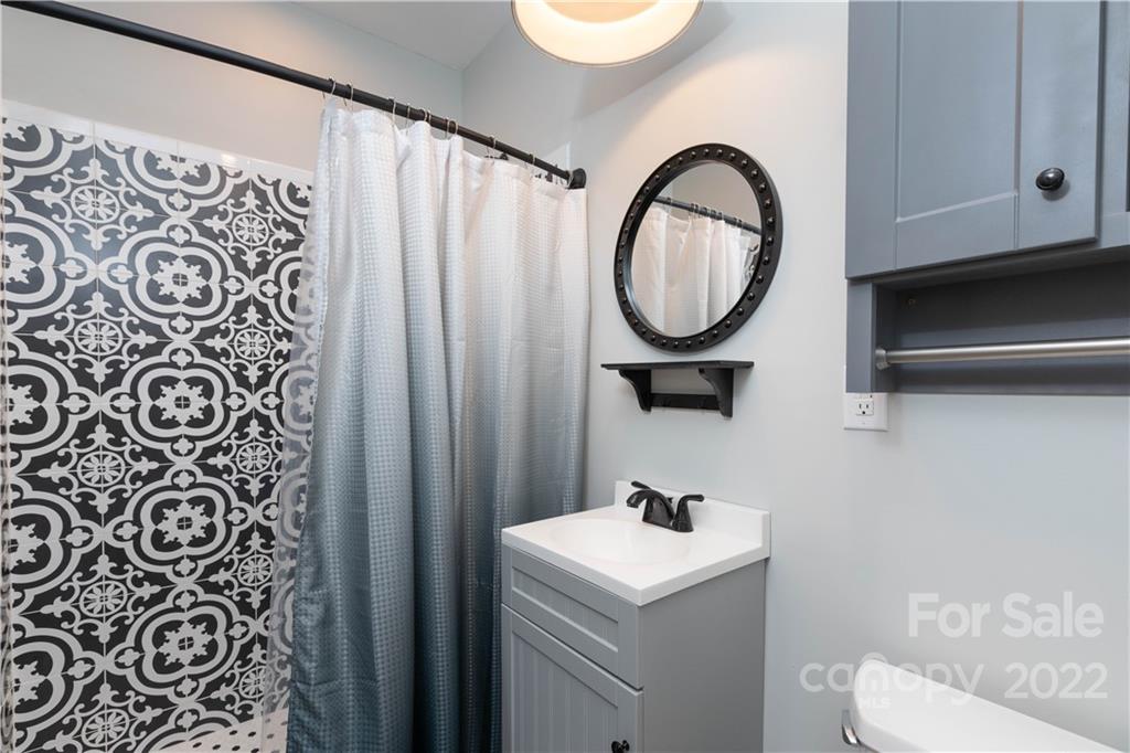 1279 Lake Road Clover, SC 29710 - Photo 24 of 44 a bathroom with a sink and a mirror