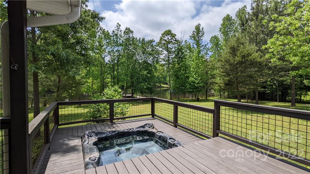 1279 Lake Road Clover, SC 29710 - Photo 29 of 44 a view of a balcony with wooden floor and bench