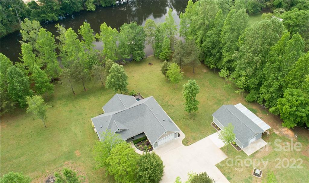 1279 Lake Road Clover, SC 29710 - Photo 3 of 44 an aerial view of a house with a yard and lake view