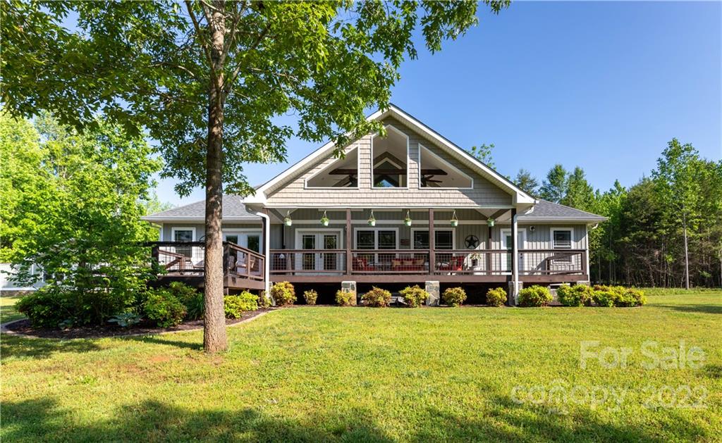 1279 Lake Road Clover, SC 29710 - Photo 34 of 44 a front view of a house with a yard table and chairs
