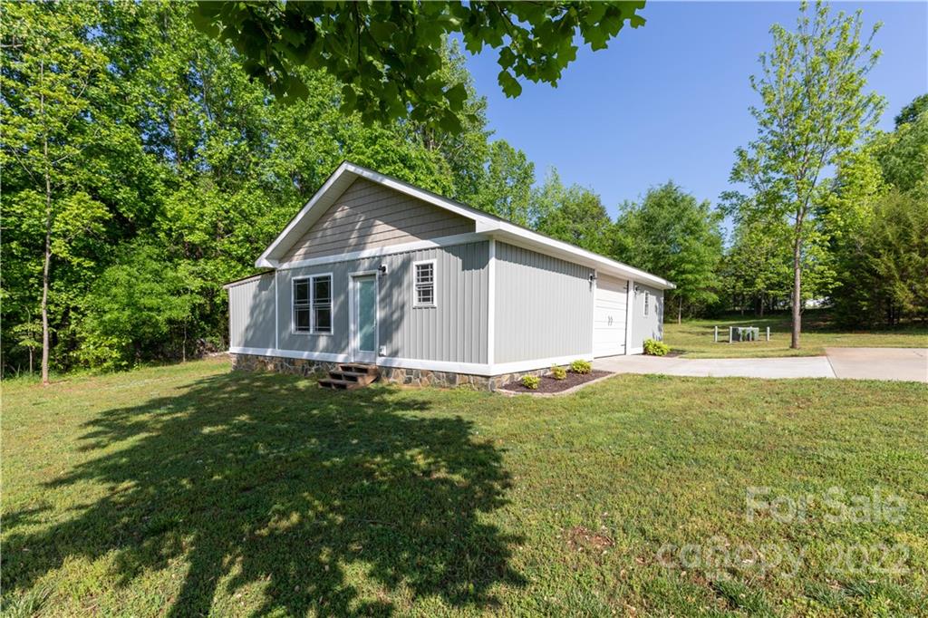 1279 Lake Road Clover, SC 29710 - Photo 40 of 44 a view of a house with a backyard