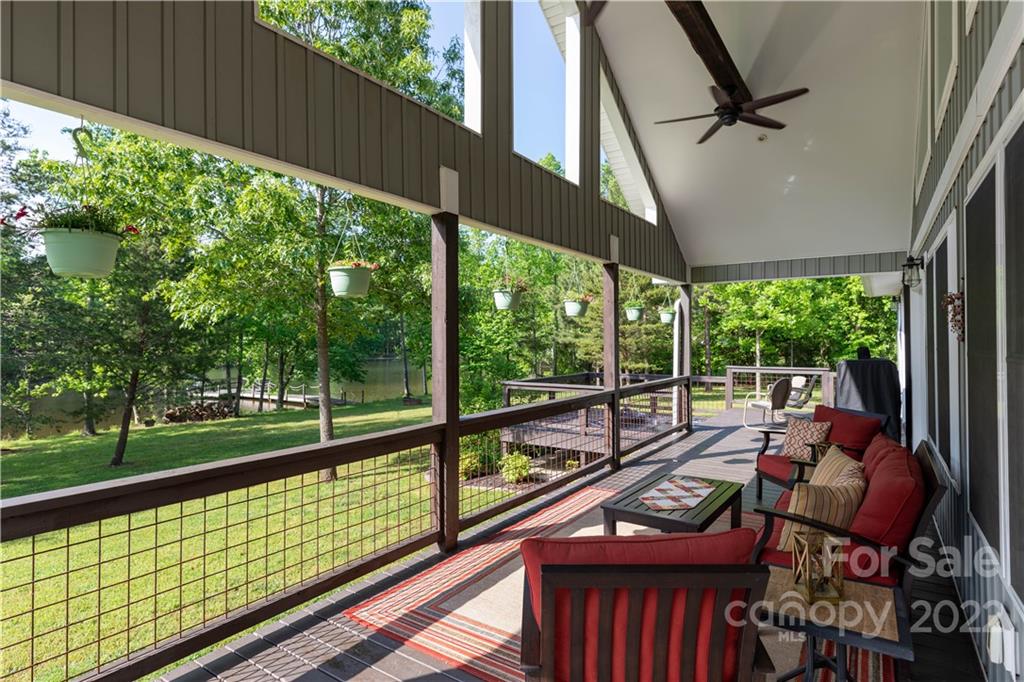 1279 Lake Road Clover, SC 29710 - Photo 41 of 44 a view of a balcony with floor to ceiling windows with wooden floor