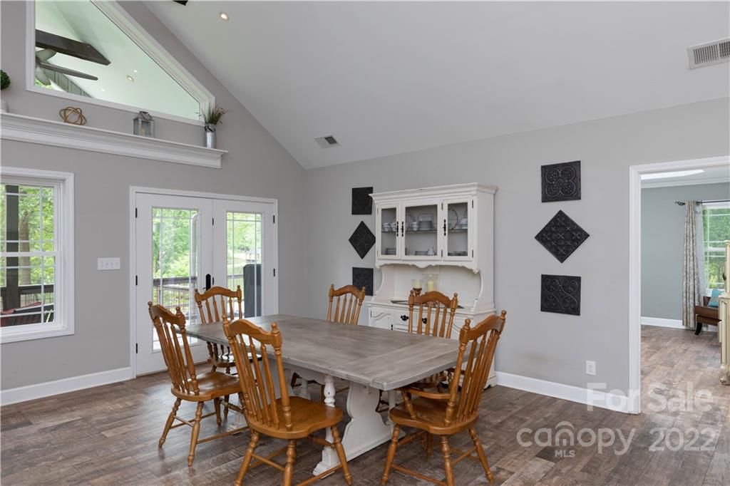 1279 Lake Road Clover, SC 29710 - Photo 9 of 44 a view of a dining room with furniture and wooden floor