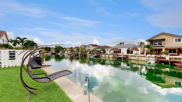 a view of a lake with a house in the background