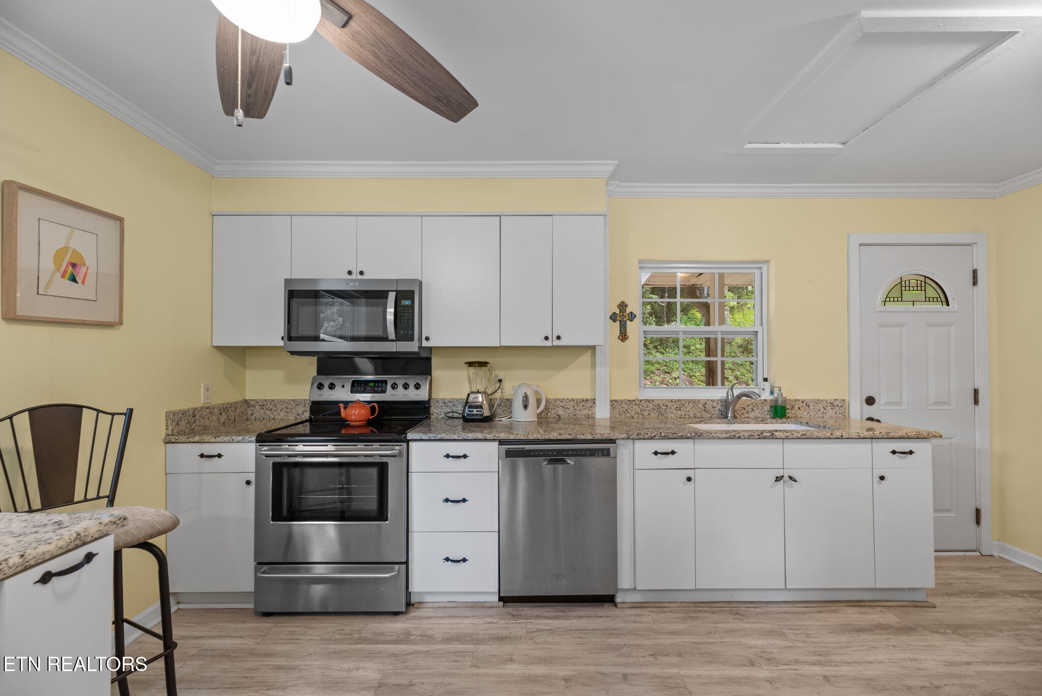 166 Outer Drive Oak Ridge, TN 37830 - Photo 12 of 30 a kitchen with stainless steel appliances granite countertop a stove and a sink