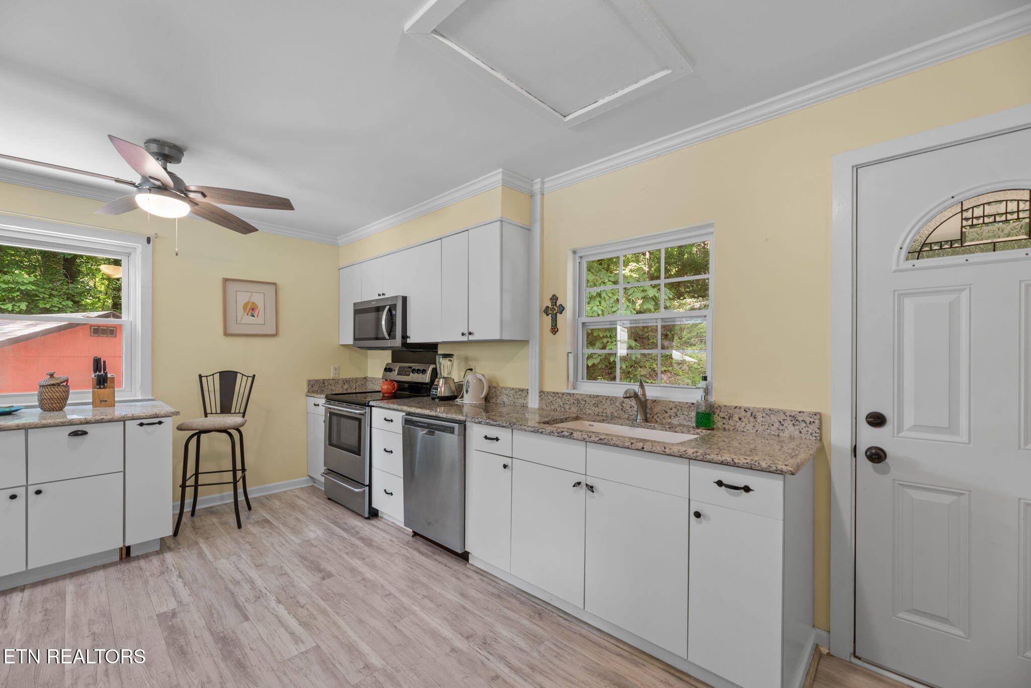 166 Outer Drive Oak Ridge, TN 37830 - Photo 13 of 30 a kitchen with a sink cabinets and wooden floor