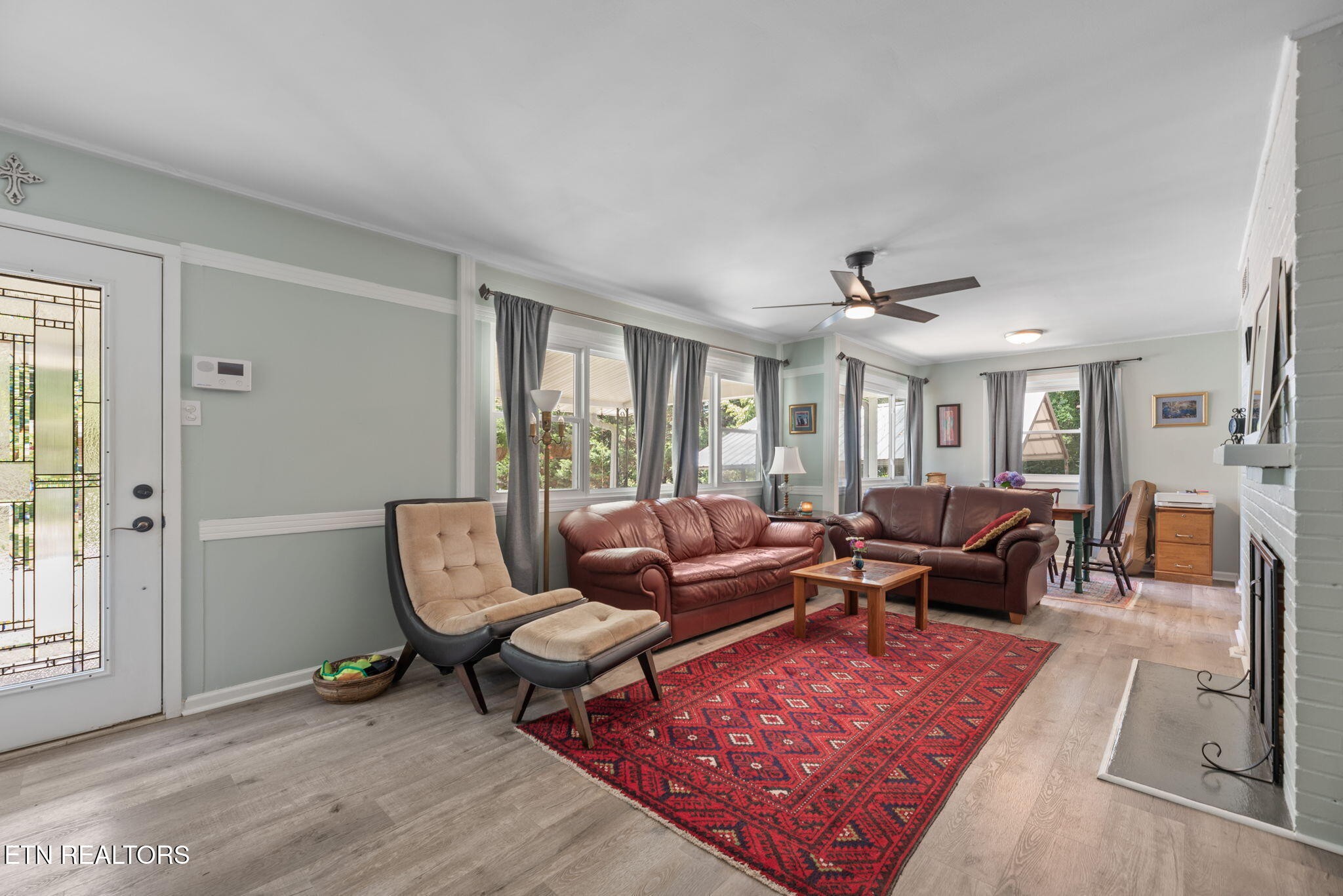 166 Outer Drive Oak Ridge, TN 37830 - Photo 7 of 30 a living room with furniture a rug and a large window