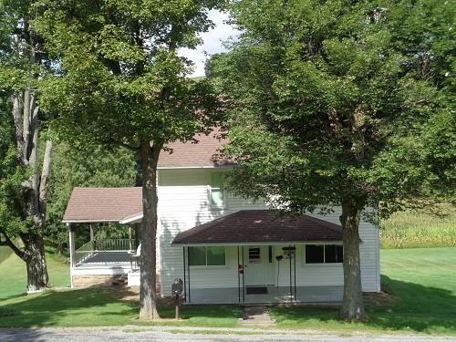 425 Shaffer Road Mayport, PA 16240 - Photo 2 of 21 a view of a yard in front of a house with plants and large tree