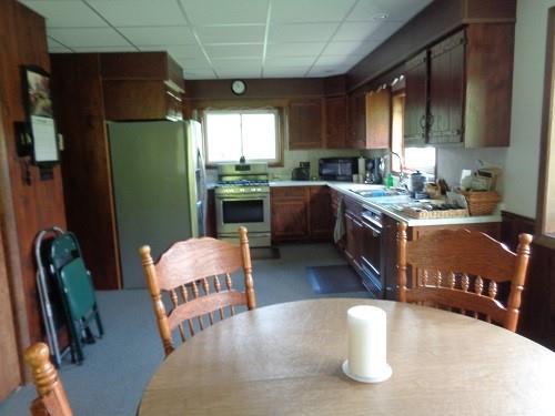 425 Shaffer Road Mayport, PA 16240 - Photo 8 of 21 a kitchen with stainless steel appliances granite countertop a refrigerator a sink a stove and a wooden floors