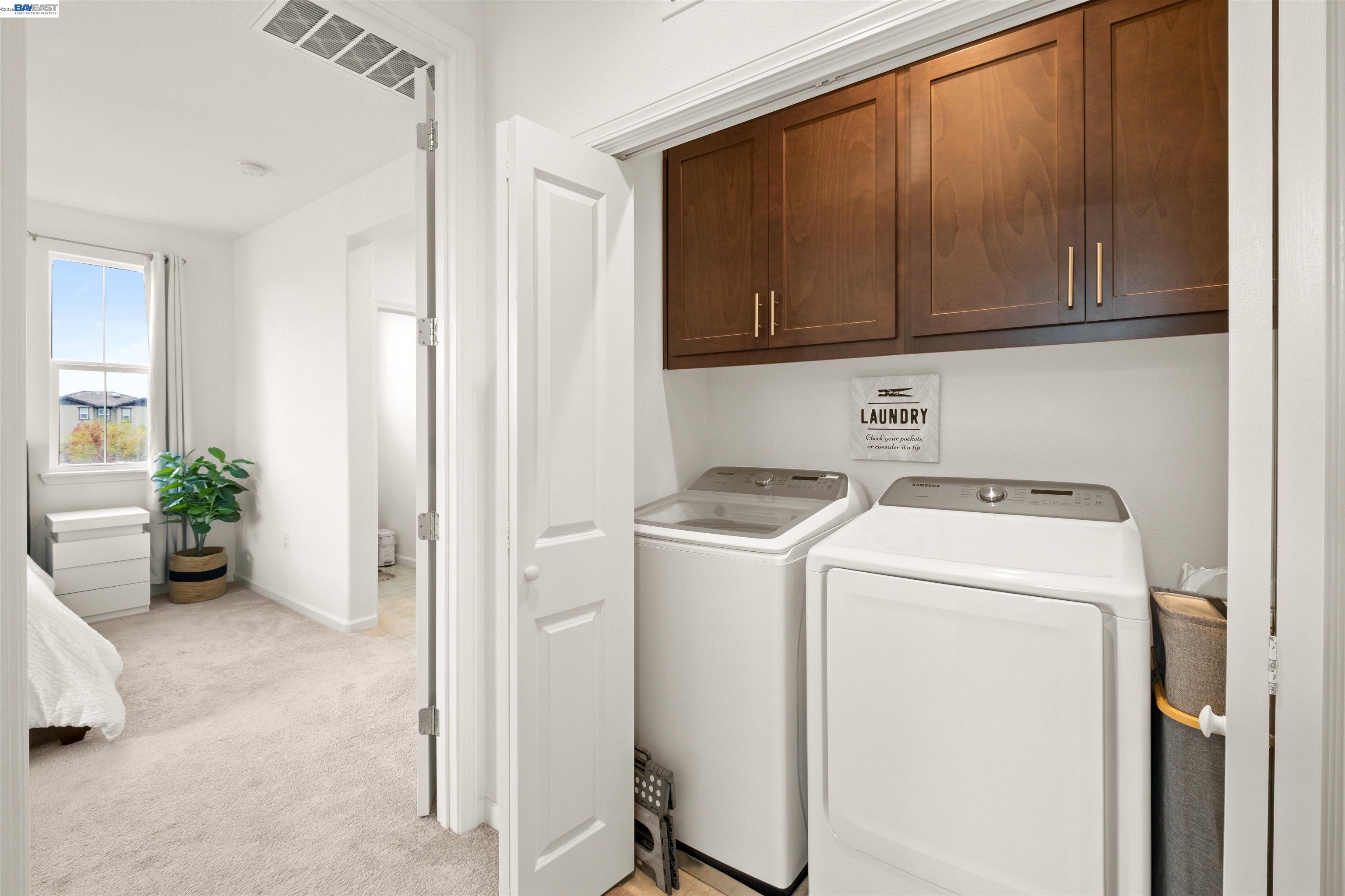 17575 Altair Way Lathrop, CA 95330 - Photo 22 of 29 a view of storage and utility room with washer and dryer