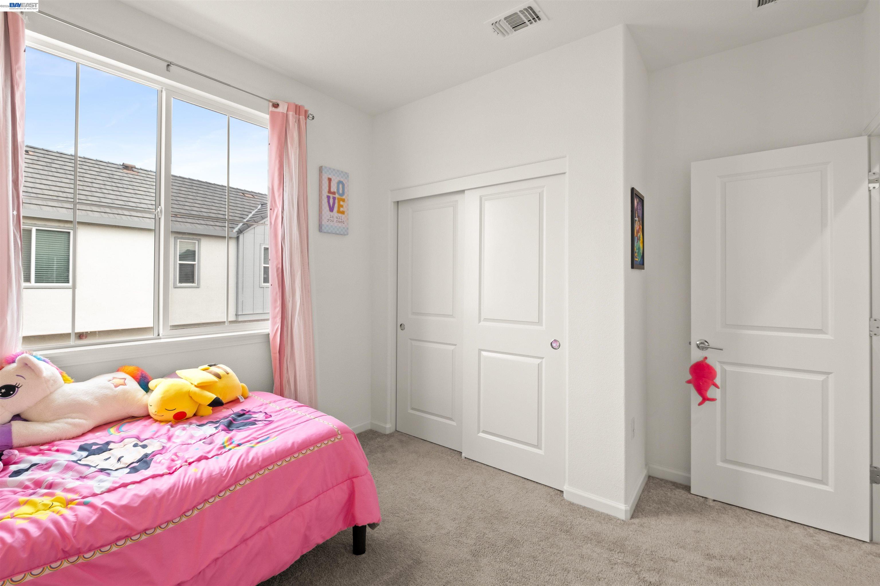 17575 Altair Way Lathrop, CA 95330 - Photo 25 of 29 a bedroom with a bed and a window