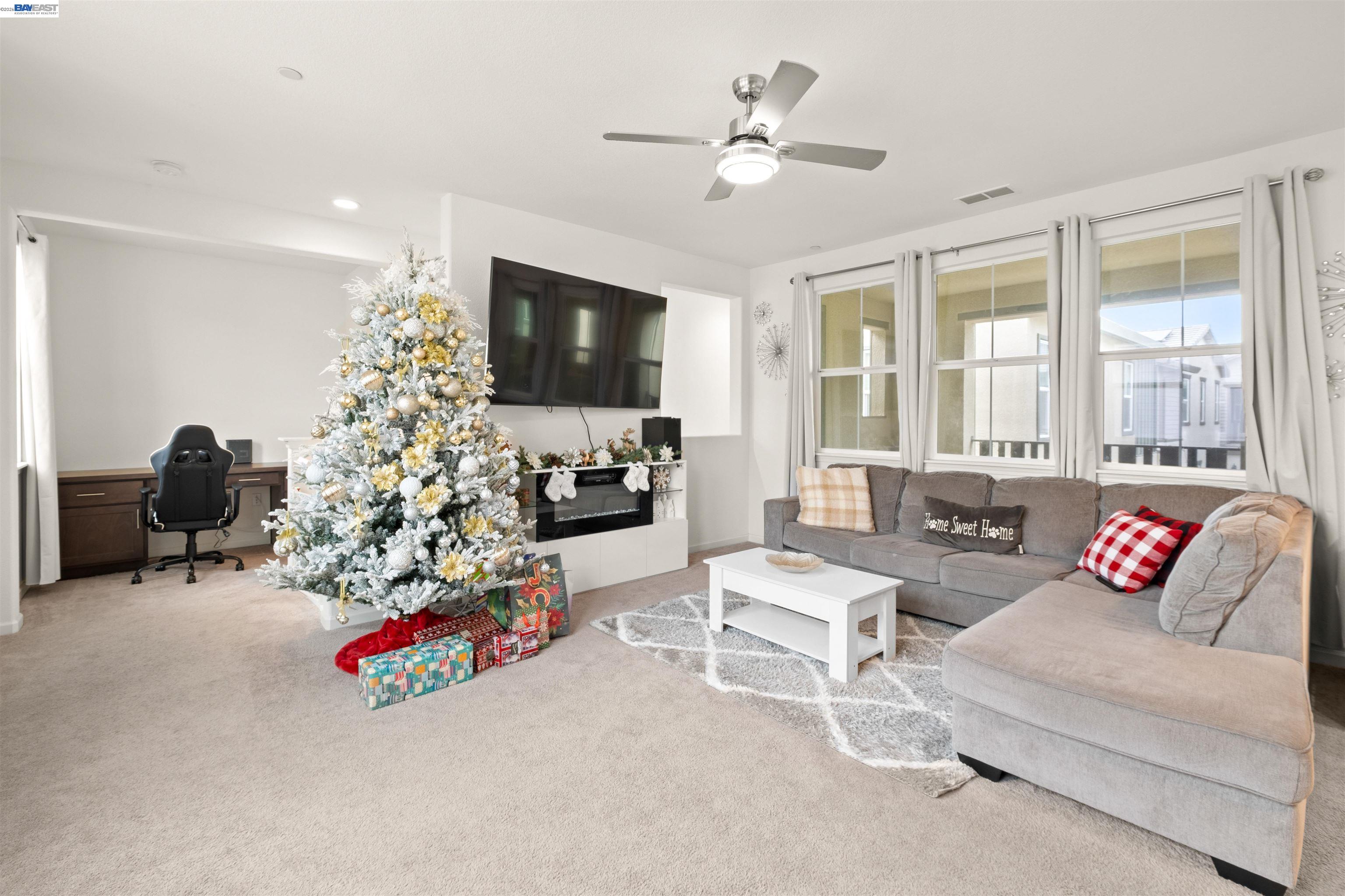 17575 Altair Way Lathrop, CA 95330 - Photo 3 of 29 a living room with furniture and a flat screen tv