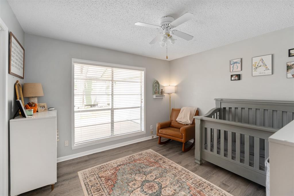 529 East Kempner Street Mabank, TX 75147 - Photo 12 of 16 a bedroom with furniture and a window