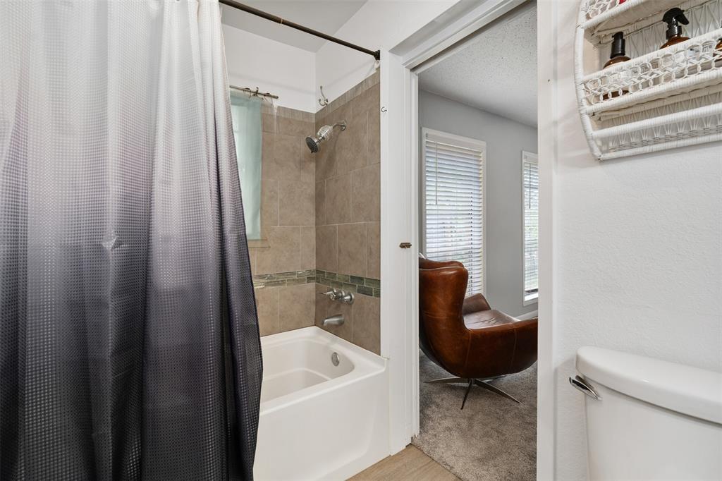 529 East Kempner Street Mabank, TX 75147 - Photo 9 of 16 a bathroom with a tub and shower