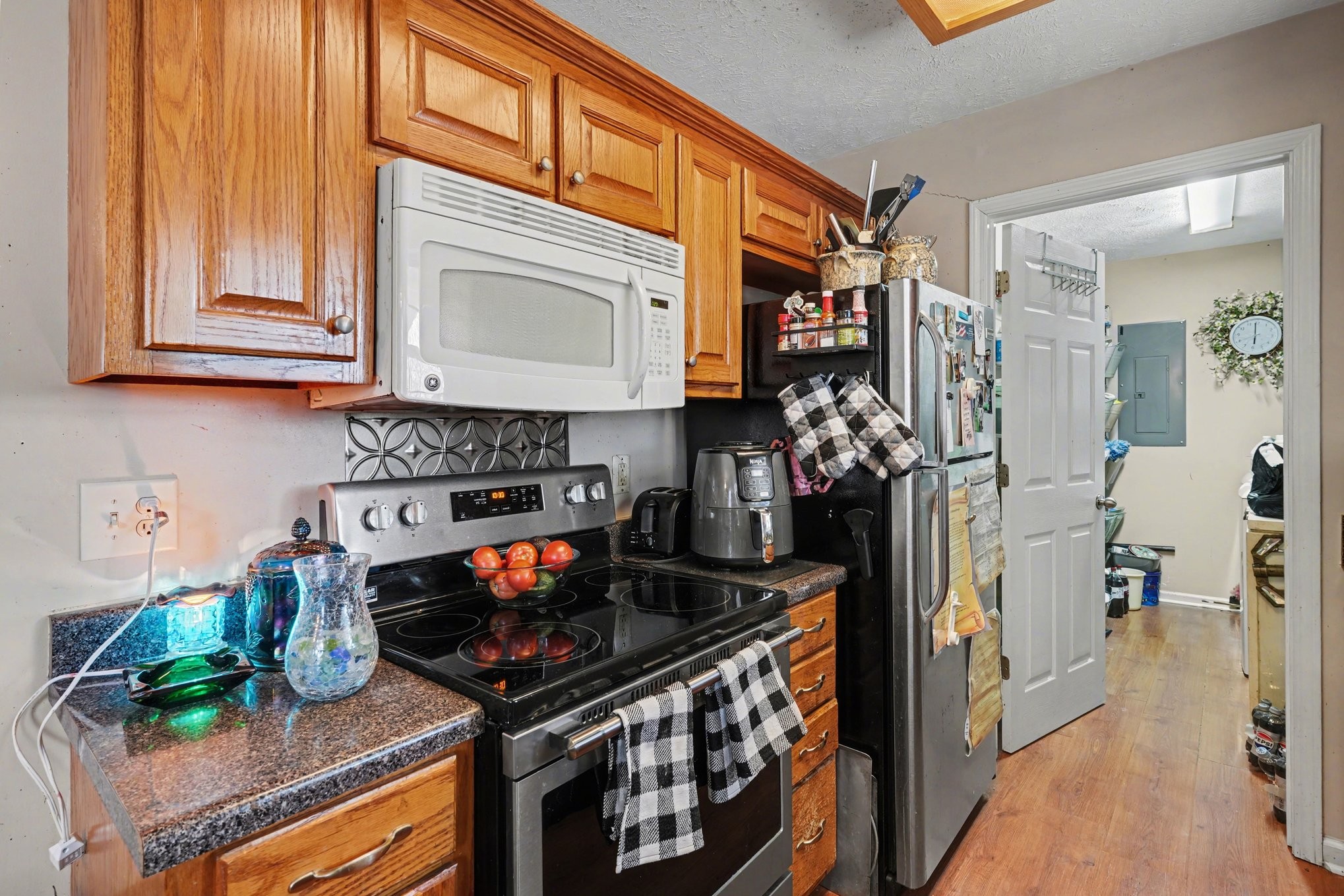 2490 Monte Murrey Road Lewisburg, TN 37091 - Photo 12 of 30 a kitchen with stainless steel appliances granite countertop a stove and cabinets