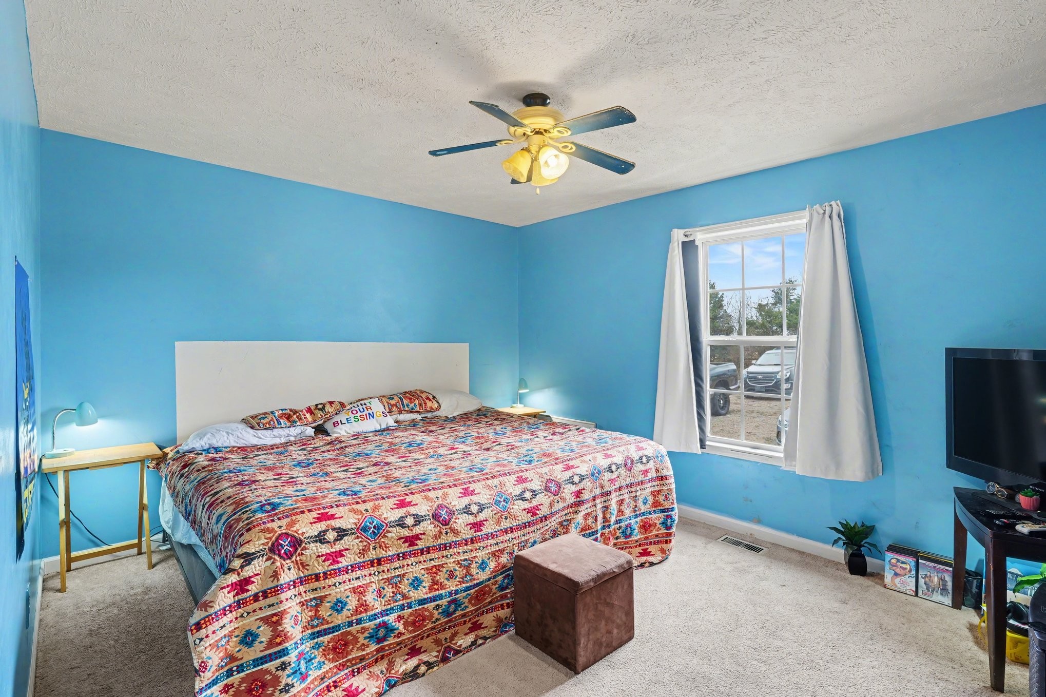 2490 Monte Murrey Road Lewisburg, TN 37091 - Photo 16 of 30 a bedroom with a bed and a chandelier